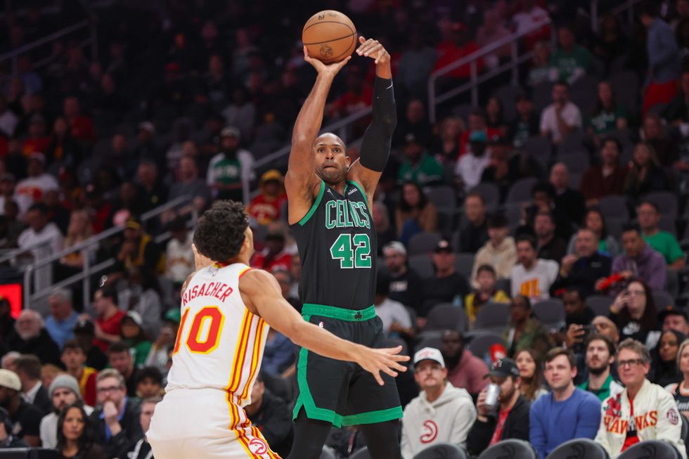 Boston Celtics center Al Horford (42) shoots against the Atlanta Hawks at State Farm Arena.