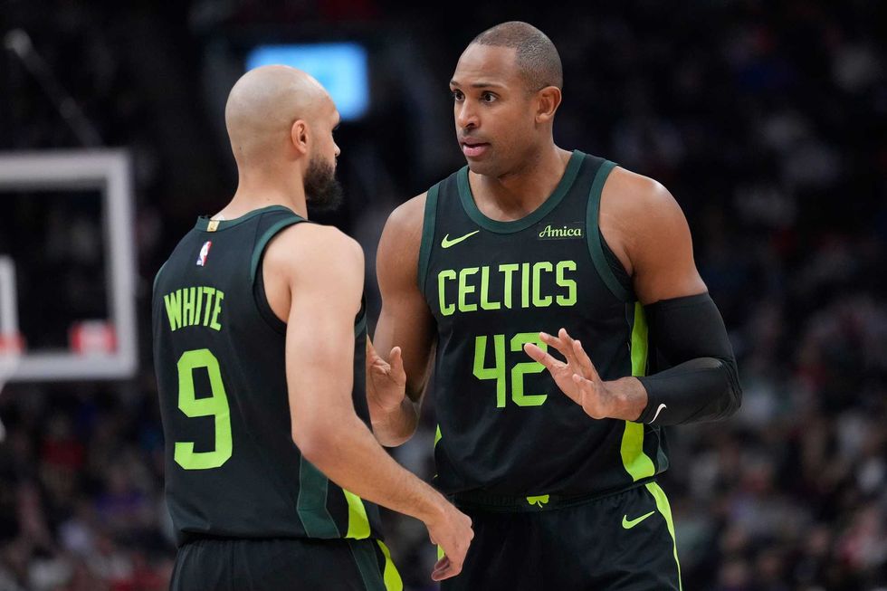 Boston Celtics center Al Horford (42) talks to guard Derrick White (9) during the first half against the Toronto Raptors at Scotiabank Arena