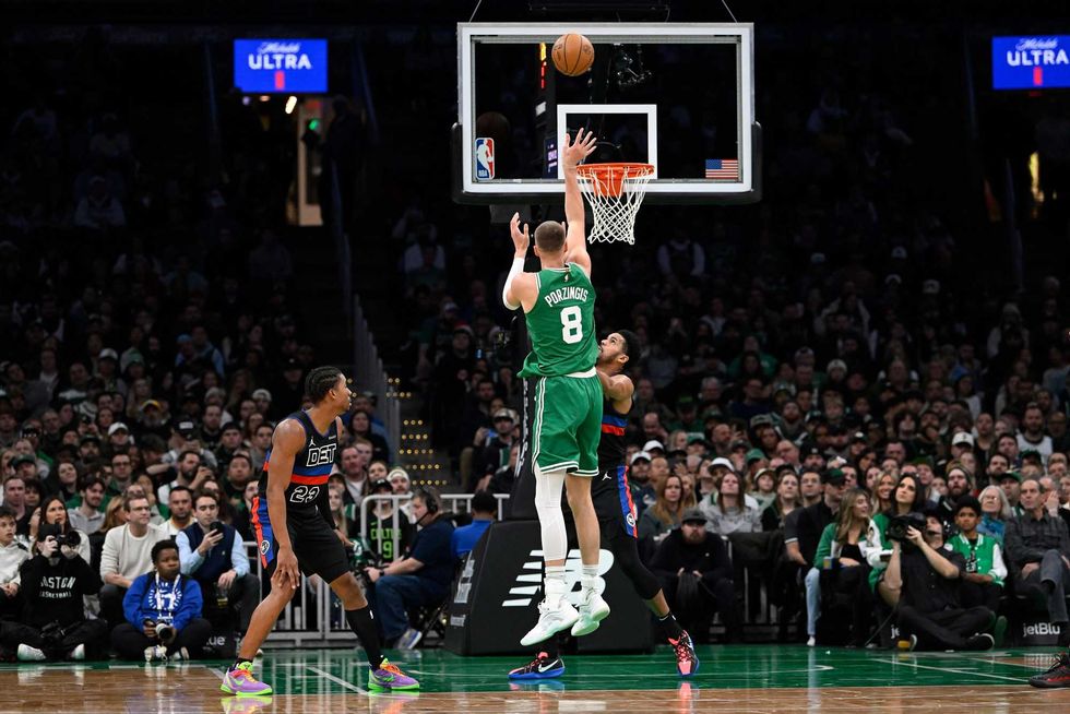 Boston Celtics center Kristaps Porzingis (8) shoots against the Detroit Pistons during the first half at TD Garden