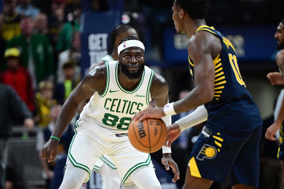 Boston Celtics center Neemias Queta (88) covers Indiana Pacers guard Bennedict Mathurin (00) during overtime at Gainbridge Fieldhouse.