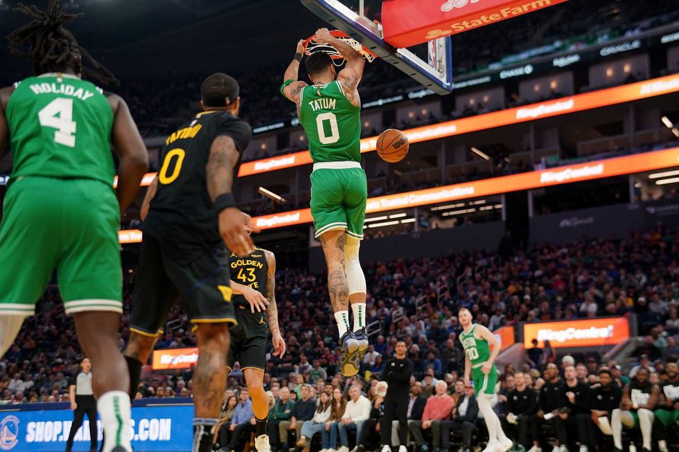 Boston Celtics forward Jayson Tatum (0) dunks the ball against the Golden State Warriors in the second quarter at the Chase Center.