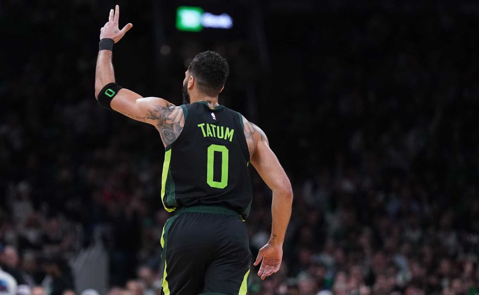 Boston Celtics forward Jayson Tatum (0) reacts after his three point basket against the Philadelphia 76ers in the second half at TD Garden.