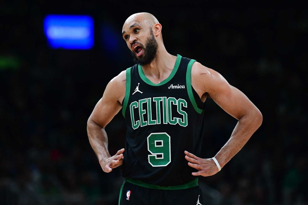 Boston Celtics guard Derrick White (9) has words with the official during the first half against the Miami Heat at TD Garden.