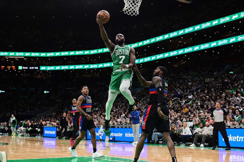 Boston Celtics guard Jaylen Brown (7) shoots a layup against the Detroit Pistons during the second half at TD Garden.