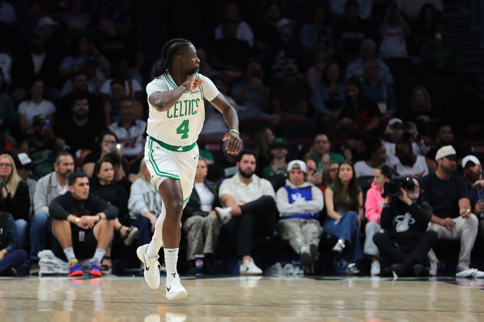 Boston Celtics guard Jrue Holiday (4) reacts after scoring against the Miami Heat during the first quarter at Kaseya Center.