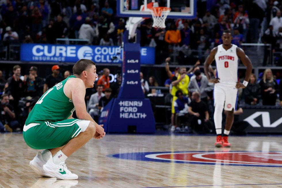 Boston Celtics guard Payton Pritchard (11) reacts in the second half against the Detroit Pistons at Little Caesars Arena.