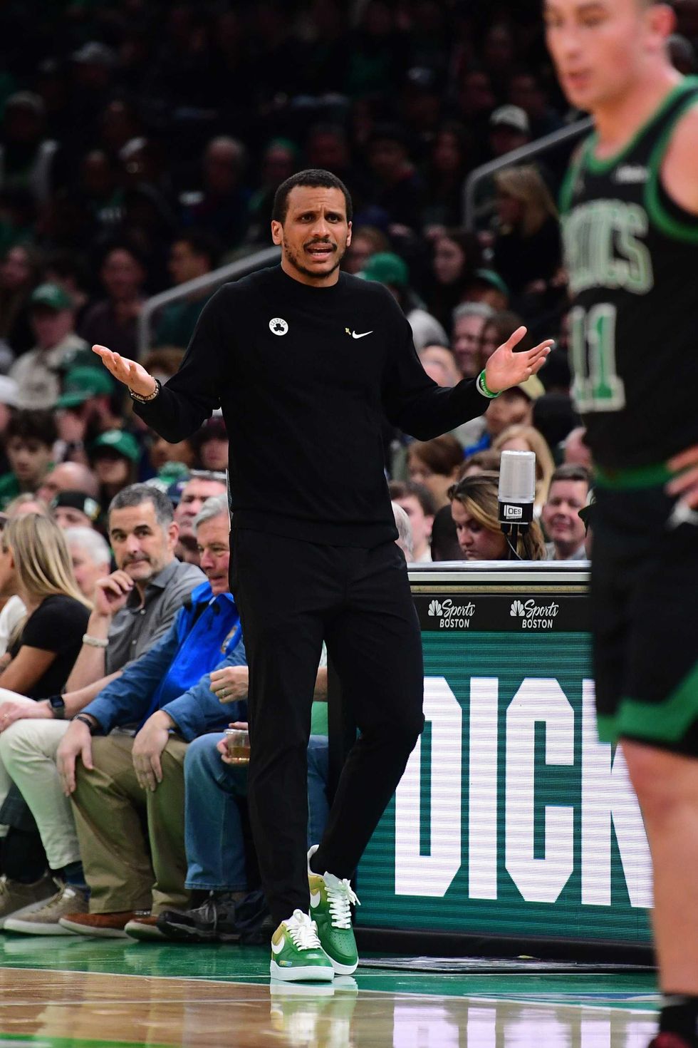 Boston Celtics head coach Joe Mazzulla reacts after a play during the first half against the Miami Heat at TD Garden.