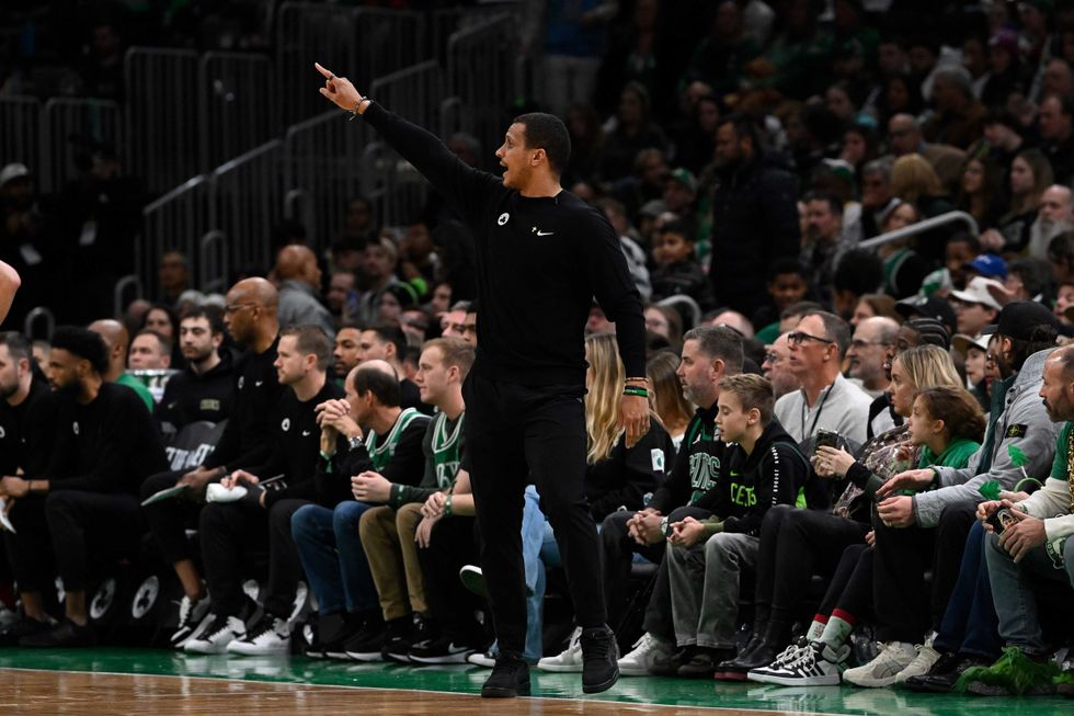 Boston Celtics head coach Joe Mazzulla signals from the sideline during the first half against the Philadelphia 76ers at TD Garden.