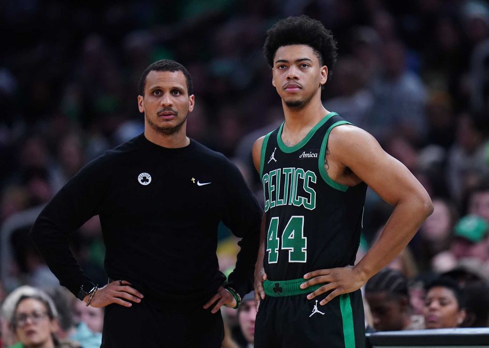 Boston Celtics head coach Joe Mazzulla talks with guard Jaden Springer (44) from the sideline as they take on the Indiana Pacers at TD Garden.