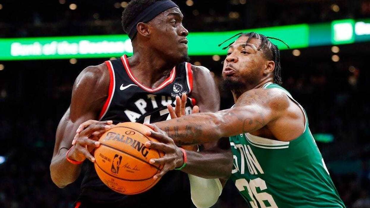 Boston Celtics' Marcus Smart (36) defends against Toronto Raptors' Pascal Siakam during the second half of an NBA basketball game in Boston, Friday, Oct. 25, 2019.