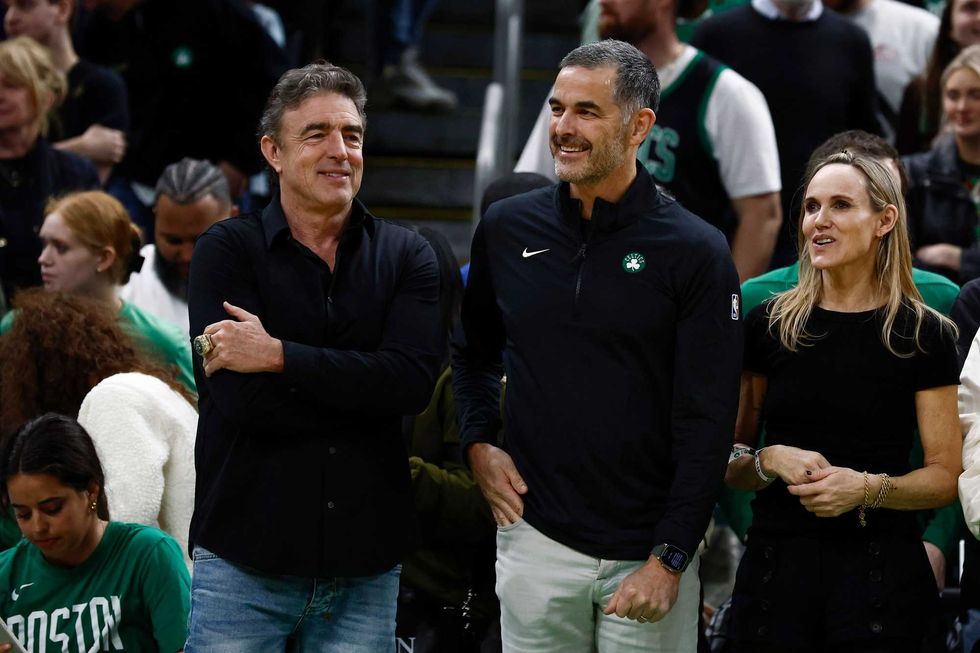 Boston, Massachusetts, USA; Bill Chisholm, center, who leads a group that is buying the Boston Celtics, stands with current owner Wyc Grousbeck and Chisholm