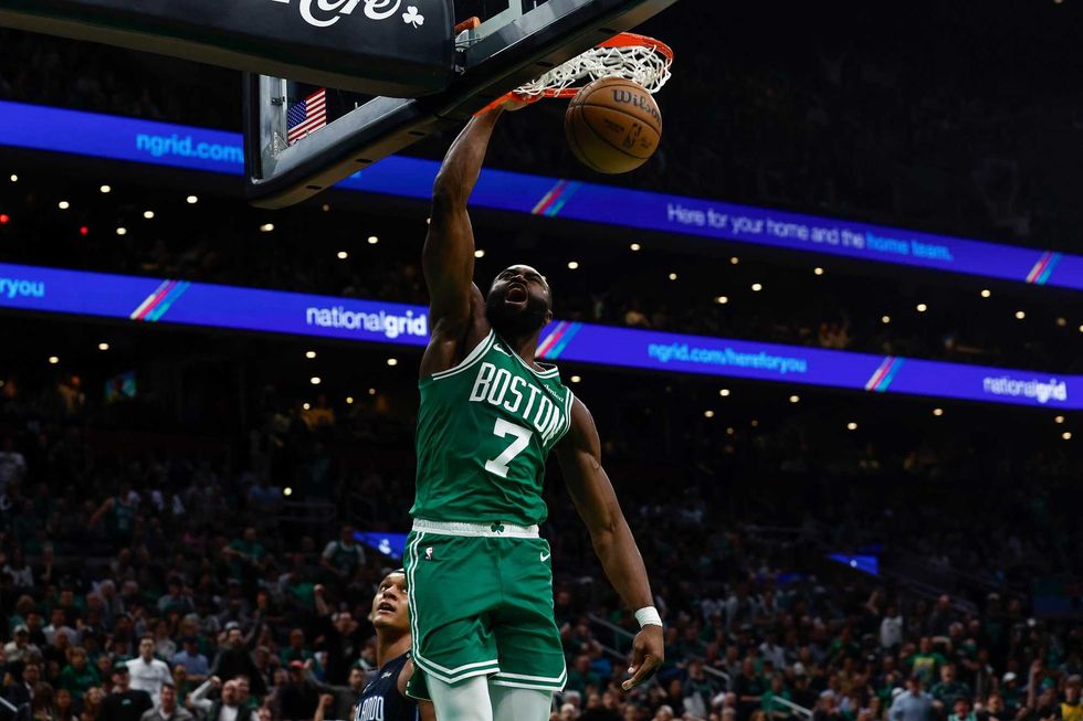 Boston, Massachusetts, USA; Boston Celtics guard Jaylen Brown (7) dunks against the Orlando Magic during the second half of game two of the first round of the 2024 NBA Playoffs at TD Garden.