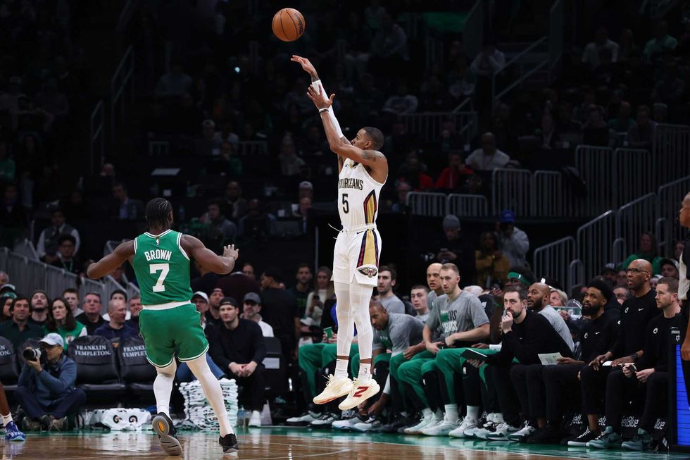 Boston, Massachusetts, USA; New Orleans Pelicans guard Dejounte Murray (5) shoots during the first half against the Boston Celtics at TD Garden.