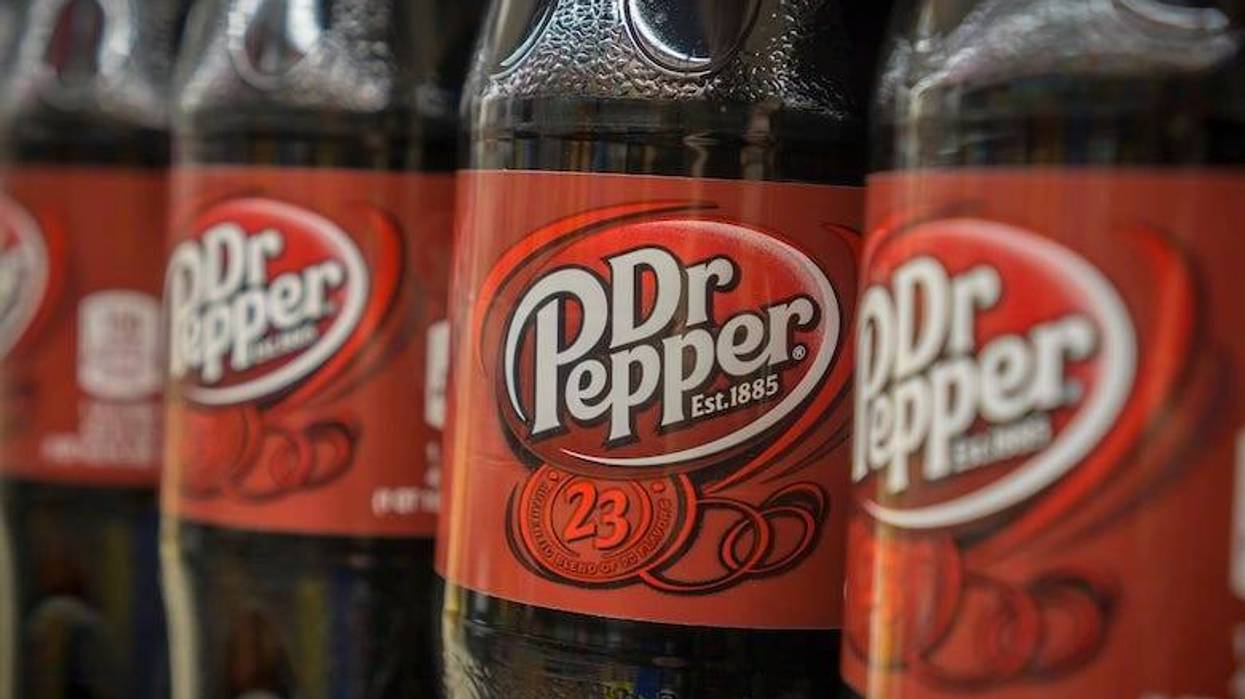 Bottles of Dr Pepper on a store shelf