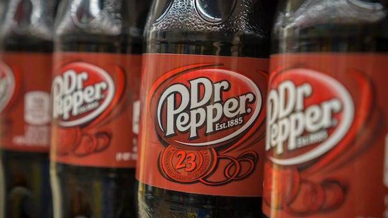 Bottles of Dr Pepper on a supermarket shelf