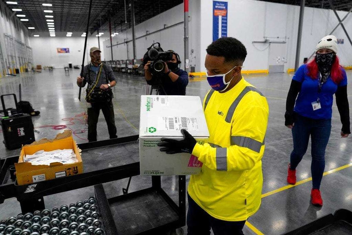 Boxes containing the Moderna COVID-19 vaccine are prepared to be shipped at the McKesson distribution center in Olive Branch, Miss., Sunday, Dec. 20, 2020.