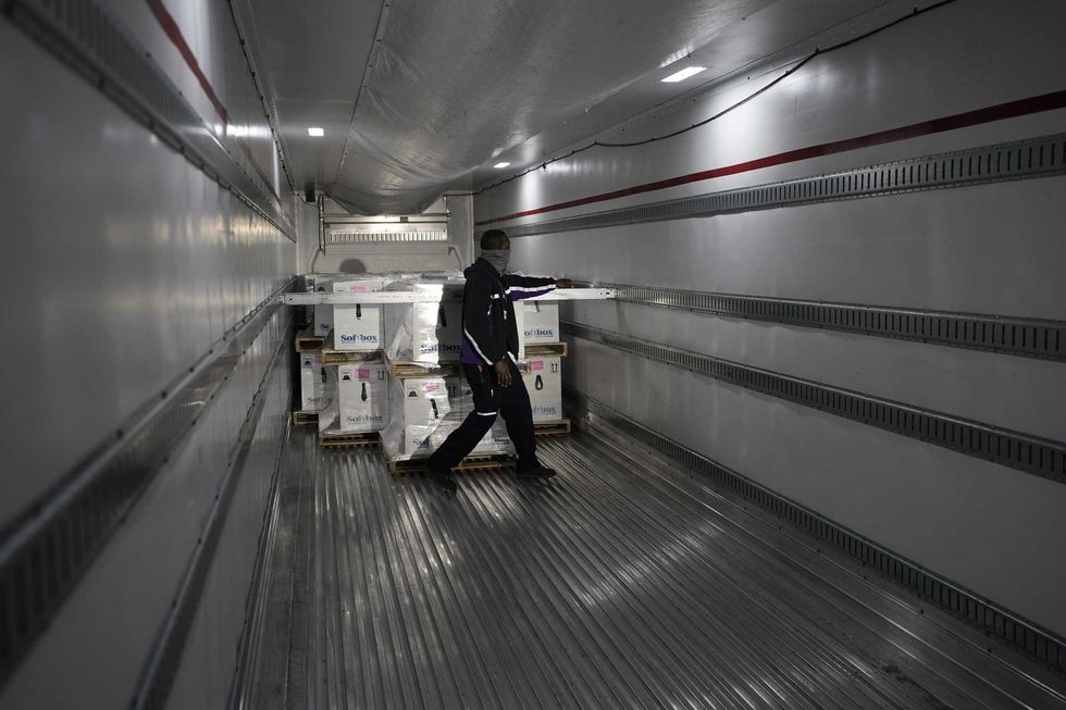 Boxes containing the Pfizer-BioNTech COVID-19 vaccine are prepared to be shipped at the Pfizer Global Supply Kalamazoo manufacturing plant on December 13, 2020 in Portage, Michigan.