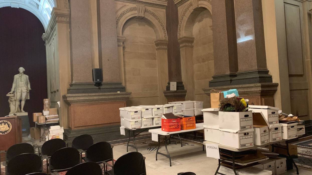 Boxes from the mayor's office are stacked temporarily in Conversation Hall.