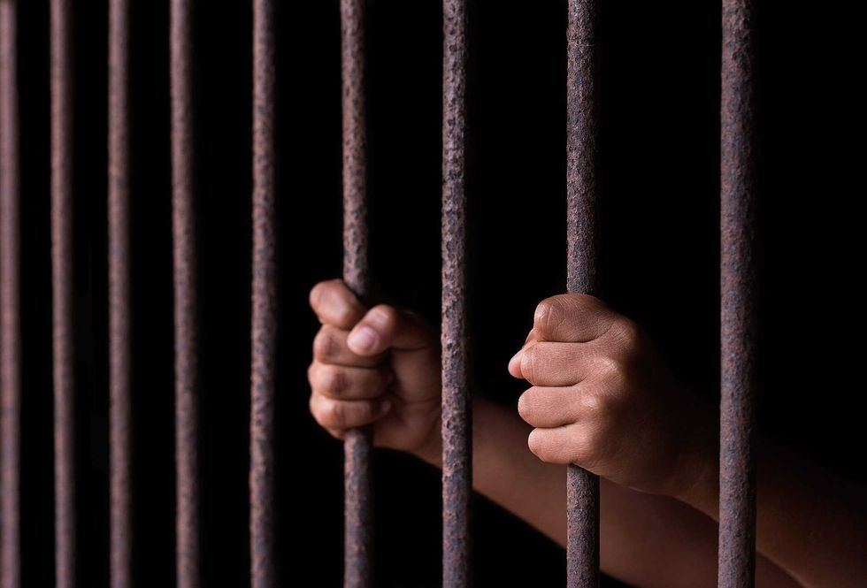 Boy hold cage with eye sad and hopeless - stock photo