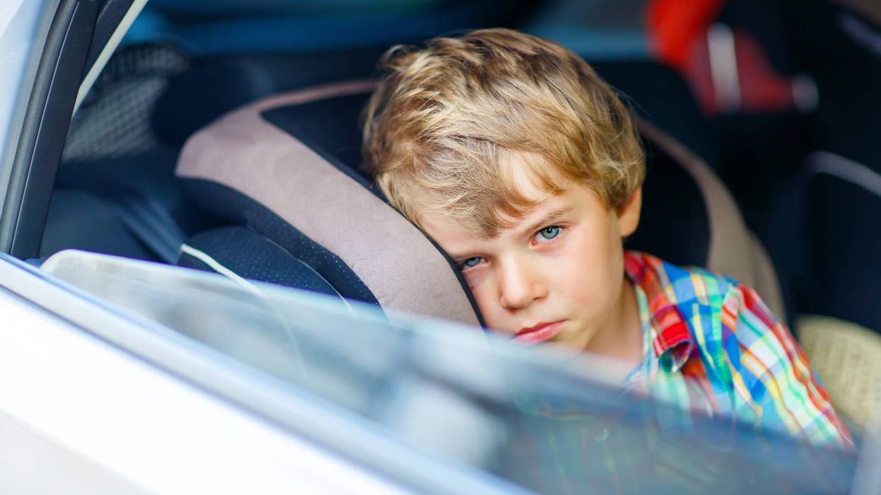 Boy left alone in vehicle
