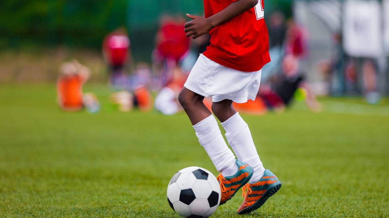 boy playing soccer
