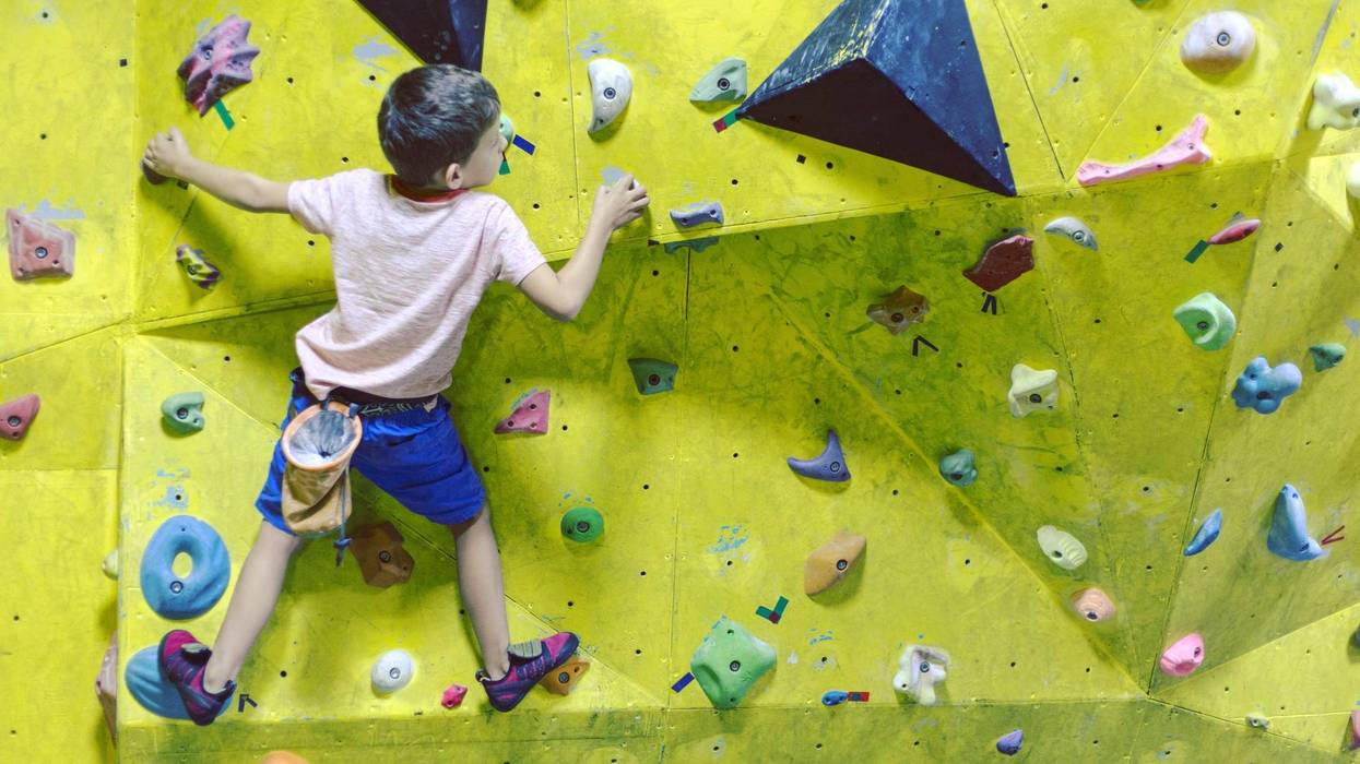 Boy rockclimbing