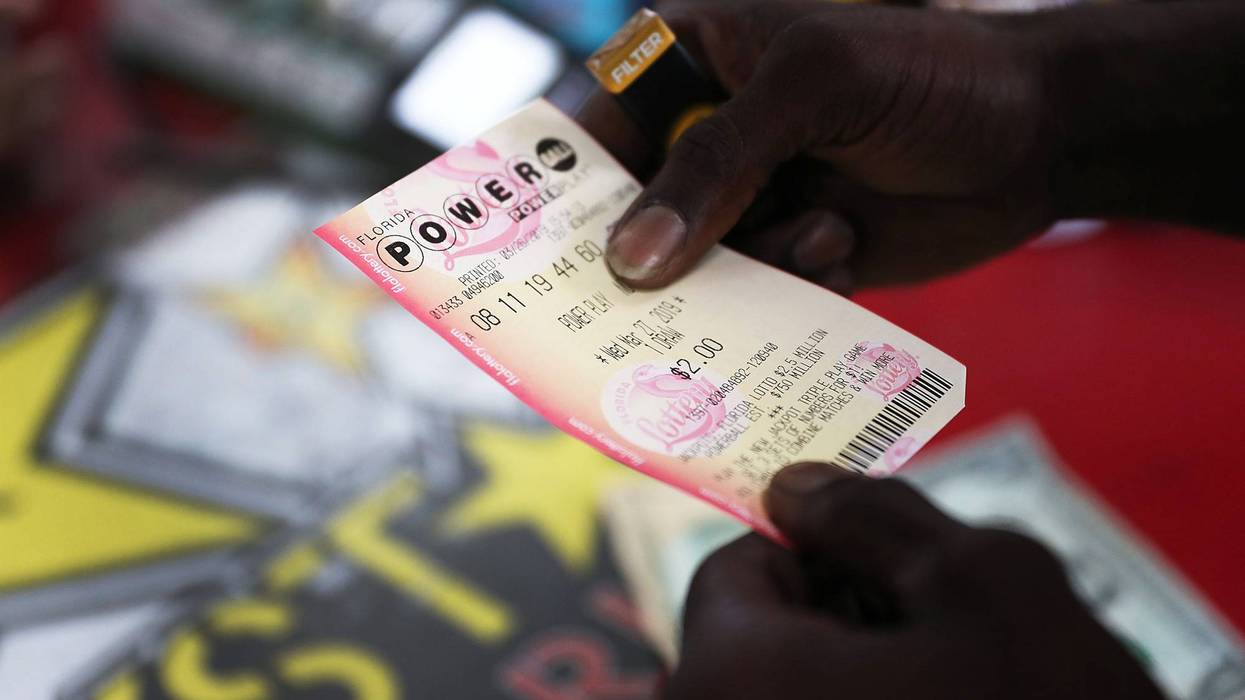 BOYNTON BEACH, FLORIDA - MARCH 26: George Hollins buys a Powerball ticket at the Shell Gateway store on March 26, 2019 in Boynton Beach, Florida. Wednesday's Powerball drawing will be an approximately $750 million jackpot which would be one of the biggest in US lottery prize history.