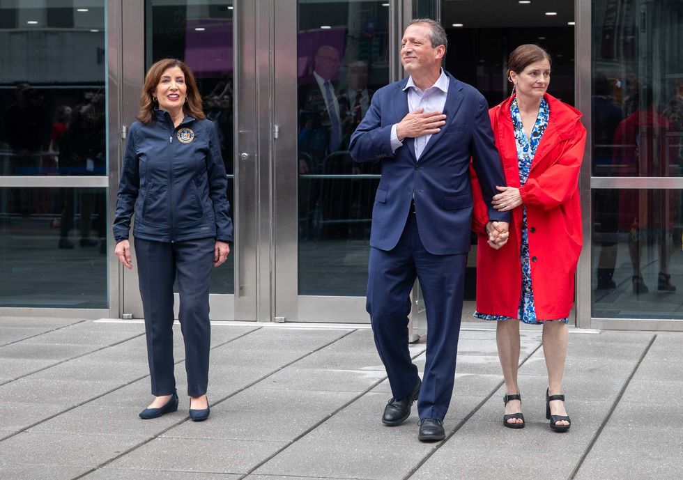 Brad Lander walks out of a federal building with his wife Meg Barnette and New York Governor Kathy Hochul, left, after he was detained by ICE agents on June 17