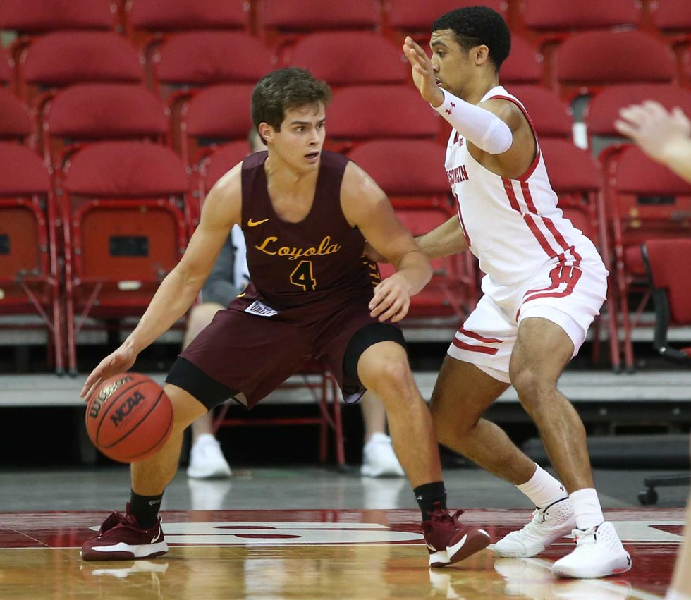 Braden Norris of Loyola Chicago backs down on a defender.