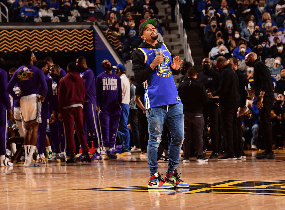 Brandon Leak performing at a Warriors game.