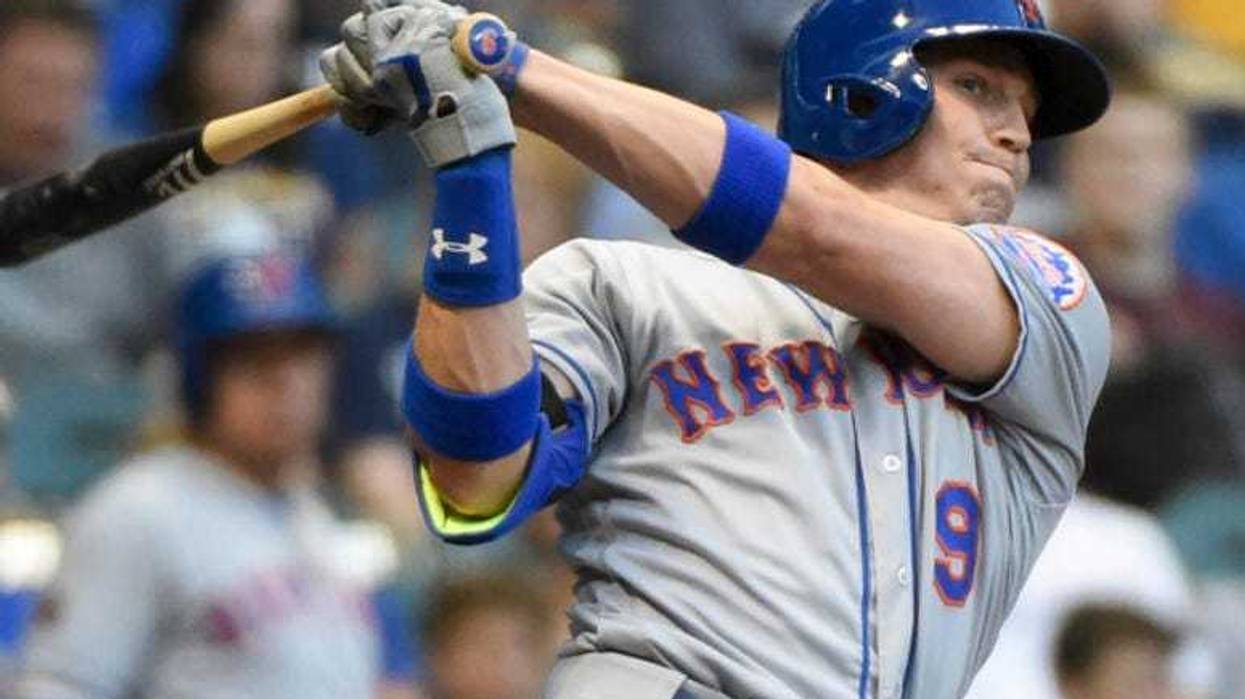 Brandon Nimmo heads to third for an inside the park home run in the first inning against the Colorado Rockies at Coors Field.