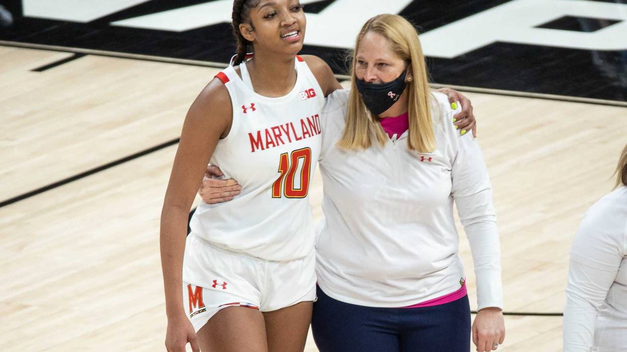 Brenda Frese and Freshman Angel Reese embrace during a MD victory in the Big 10 Tournament