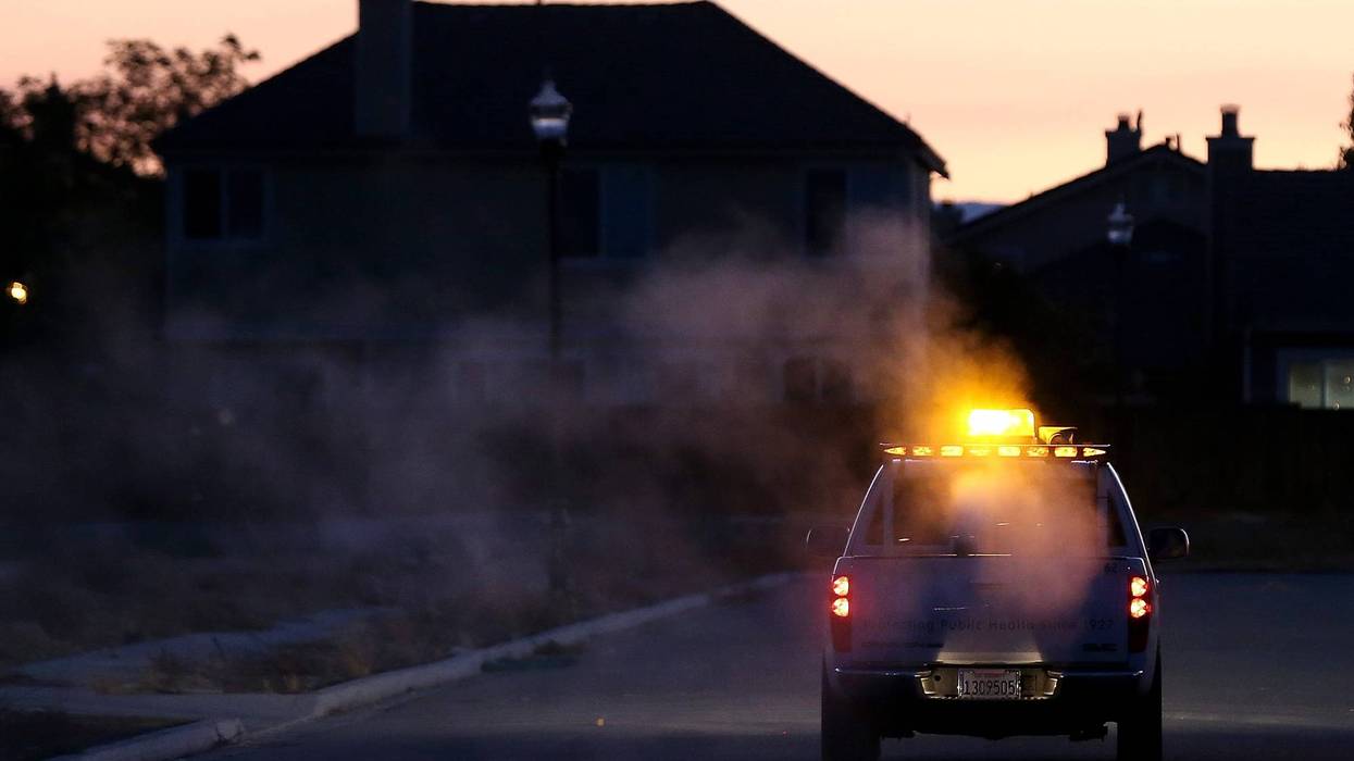 BRENTWOOD, CA - AUGUST 23: Technicians with the Contra Costa County Mosquito and Vector Control District drive a truck through a neighborhood fogging with Pyrocide 7396 insecticide on August 23, 2012 in Brentwood, California. In the wake of the largest outbreak of the West Nile Virus in the U.S. history, the Contra Costa County Mosquito and Vector Control is fogging areas of the county that have seen a spike in numbers of mosquitoes carrying the West Nile Virus. More than 1,100 people in the Unites States have been infected with West Nile and 41 people have died. (Photo by Justin Sullivan/Getty Images)