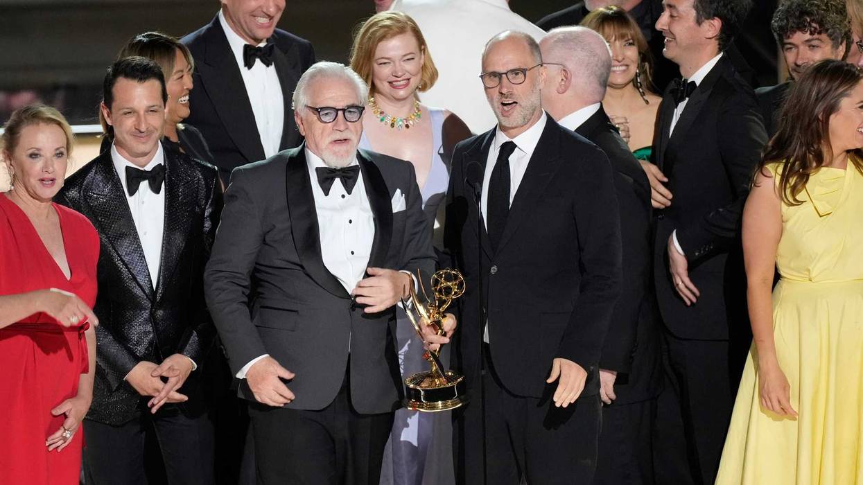 Brian Cox (center left) and Jesse Armstrong (center right) accept the award for outstanding drama series for the HBO program Succession along with cast and crew during the 74th Emmy Awards at the Microsoft Theater in Los Angeles on Sept. 12, 2022.