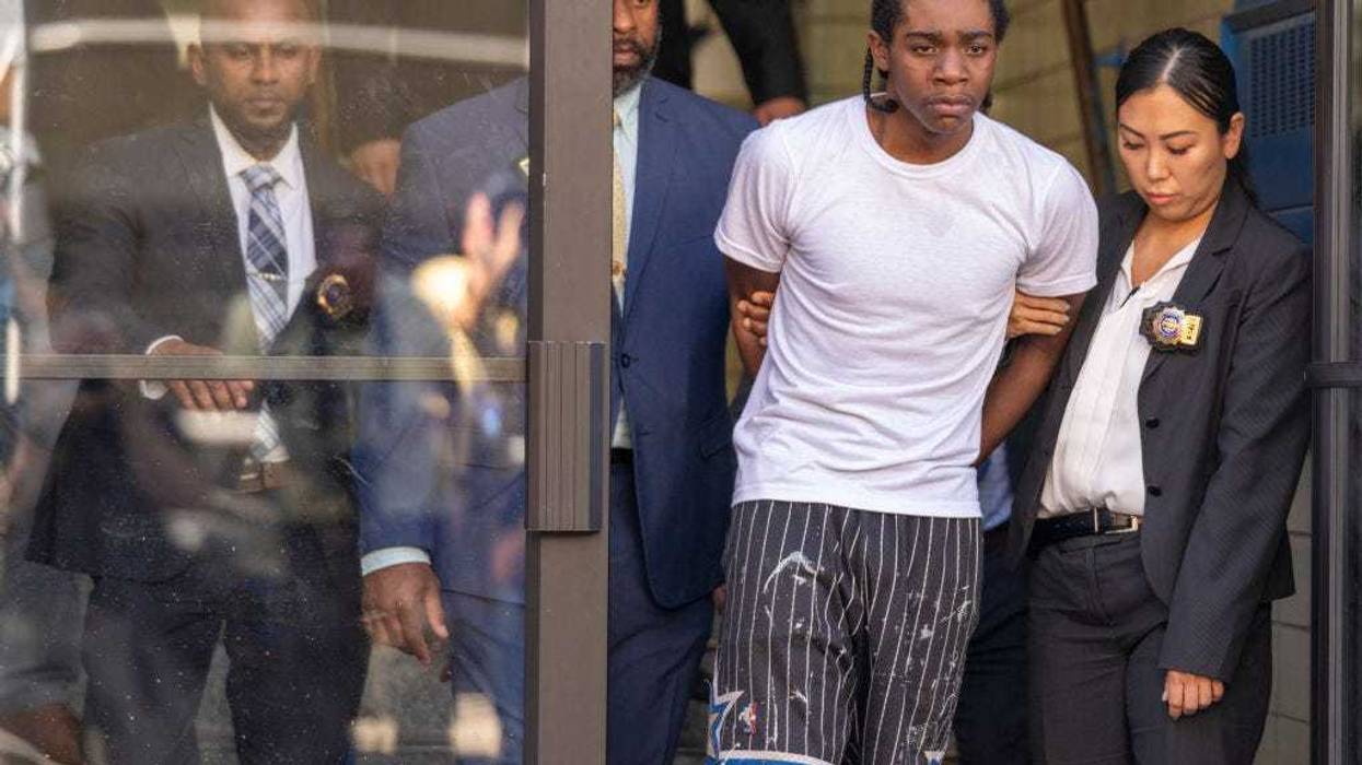 Brian Dowling, then-18, walks from the 81st Precinct on Oct. 5, 2023 after being charged in the murder of Ryan Carson.