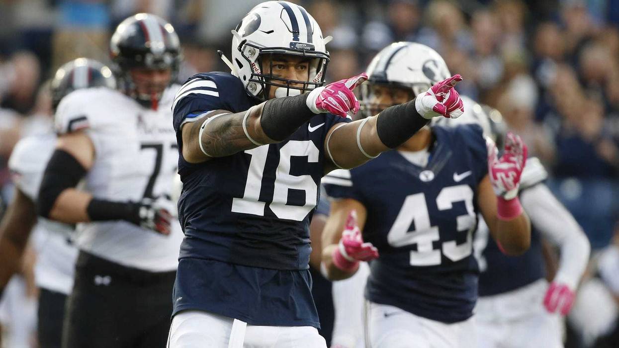 Brigham Young Cougars linebacker Sione Takitaki (16) reacts after making a tackle for no gain against the Cincinnati Bearcats in the first quarter at Lavell Edwards Stadium.