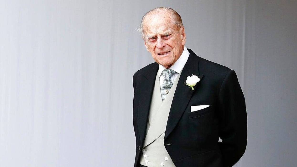 Britain's Prince Philip waits for the bridal procession following the wedding of Princess Eugenie of York and Jack Brooksbank in St George's Chapel, Windsor Castle, near London, England