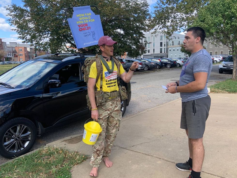 British Army Major Chris Brannigan, walking barefoot through Philadelphia to North Carolina to raise money in the fight against CdLS.