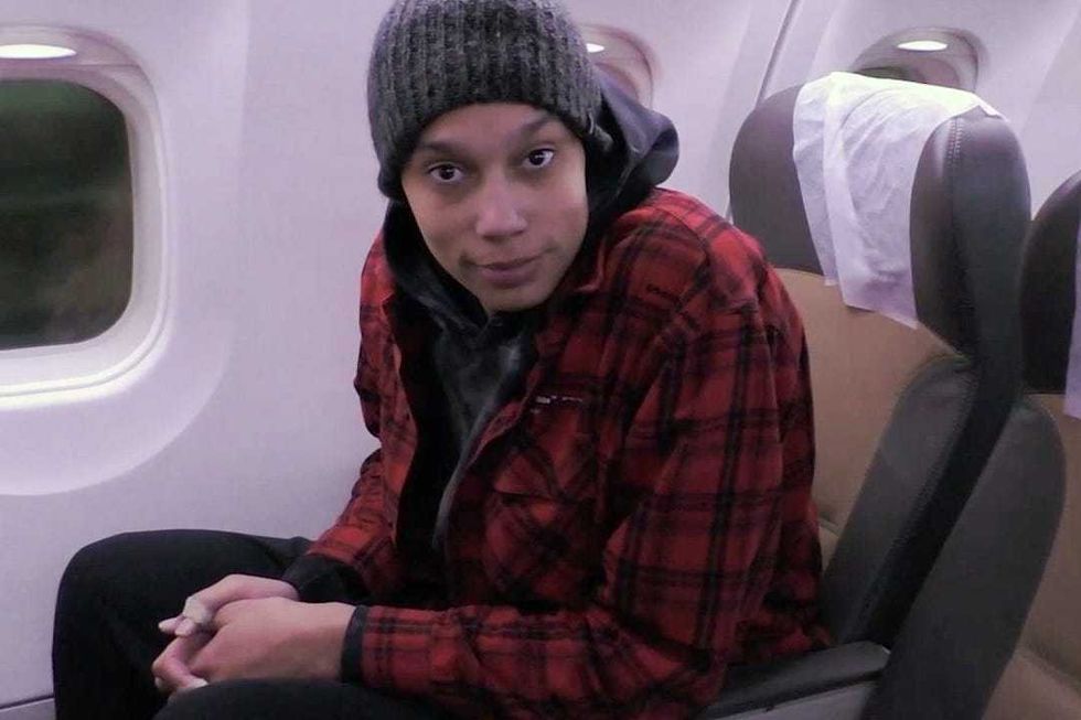Brittney Griner is seen on a plane in the United Arab Emirates, where the prisoner swap was made, ahead of her flight to the U.S. on Dec. 8, 2022