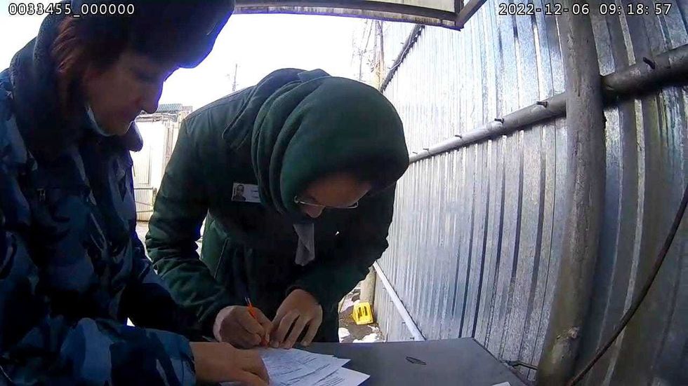 Brittney Griner signs papers at Women