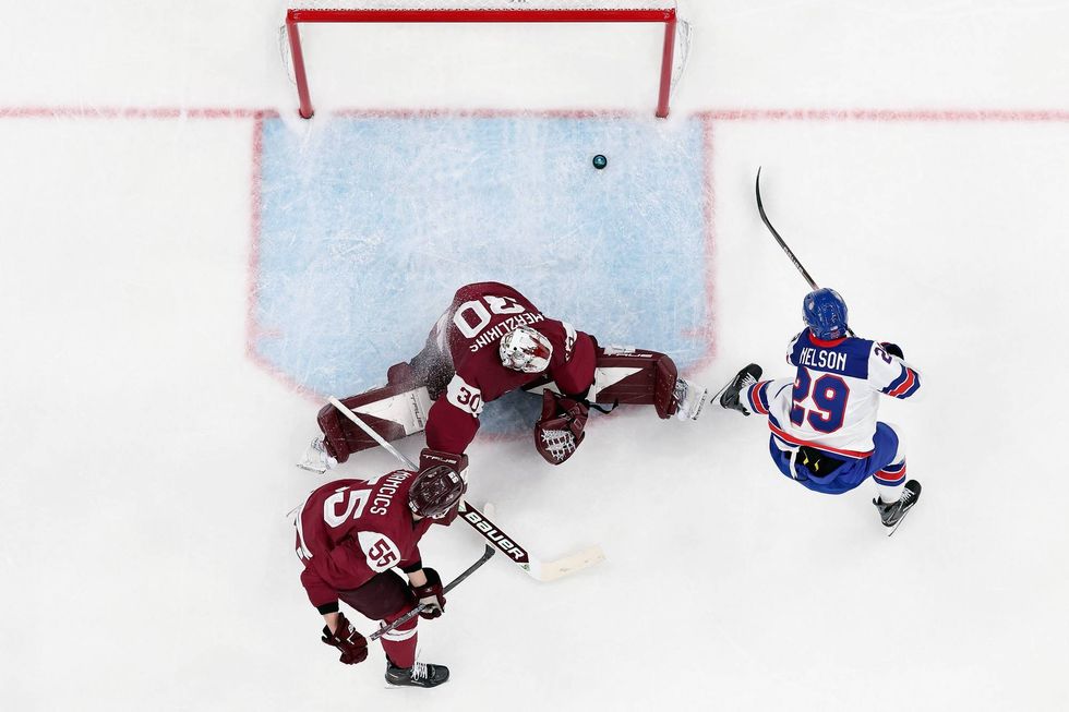 Brock Nelson #29 of Team United States scores a goal against Elvis Merzlikins #30 of Team Latvia in the second period during the Men