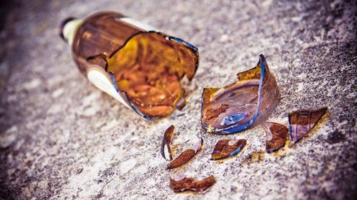 Broken beer bottle on the pavement