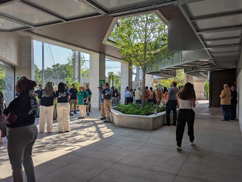 Brookfield Zoo guests walk under primate tunnels between habitats