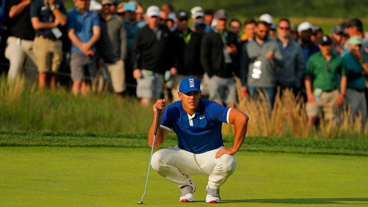 Brooks Koepka lines up a putt on the 17th green during the second round of the PGA Championship golf tournament, Friday, May 17, 2019, at Bethpage Black in Farmingdale, N.Y.