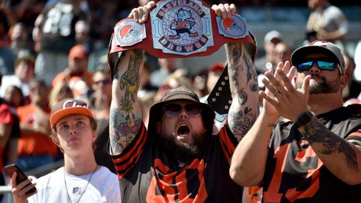 Browns fan holds up a wrestling belt