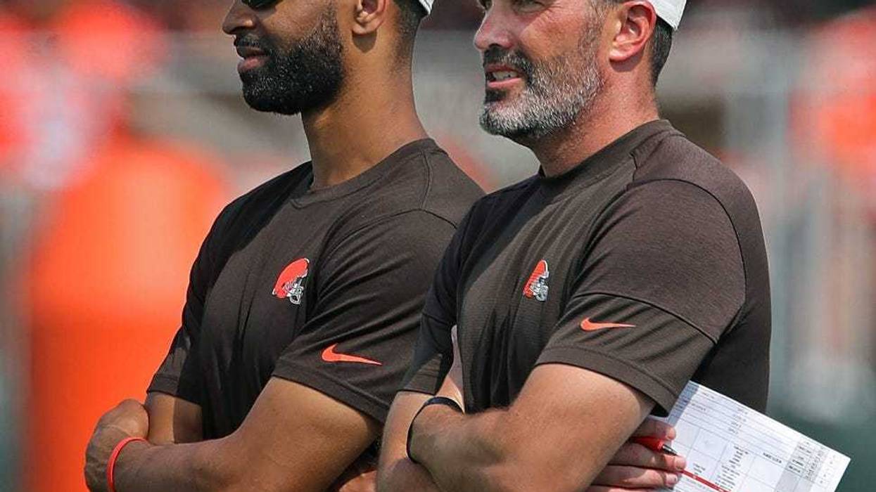 Browns GM Andrew Berry, left, and coach Kevin Stefanski watch practice in training camp, Saturday, July 31, 2021, in Berea.