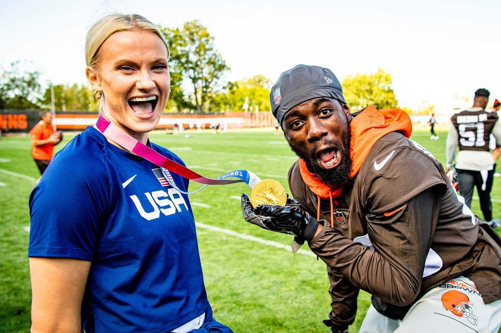 Browns linebacker Jeremiah Owusu-Koramoah reacts to holding Katie Nageotte