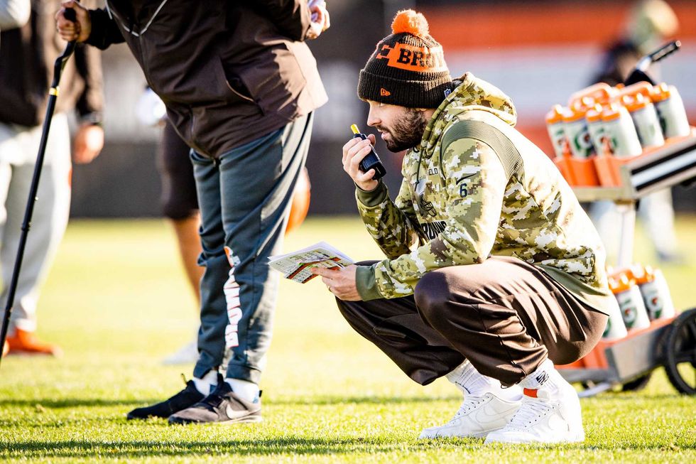 Browns quarterback Baker Mayfield radios in a play during practice on November 24, 2021.