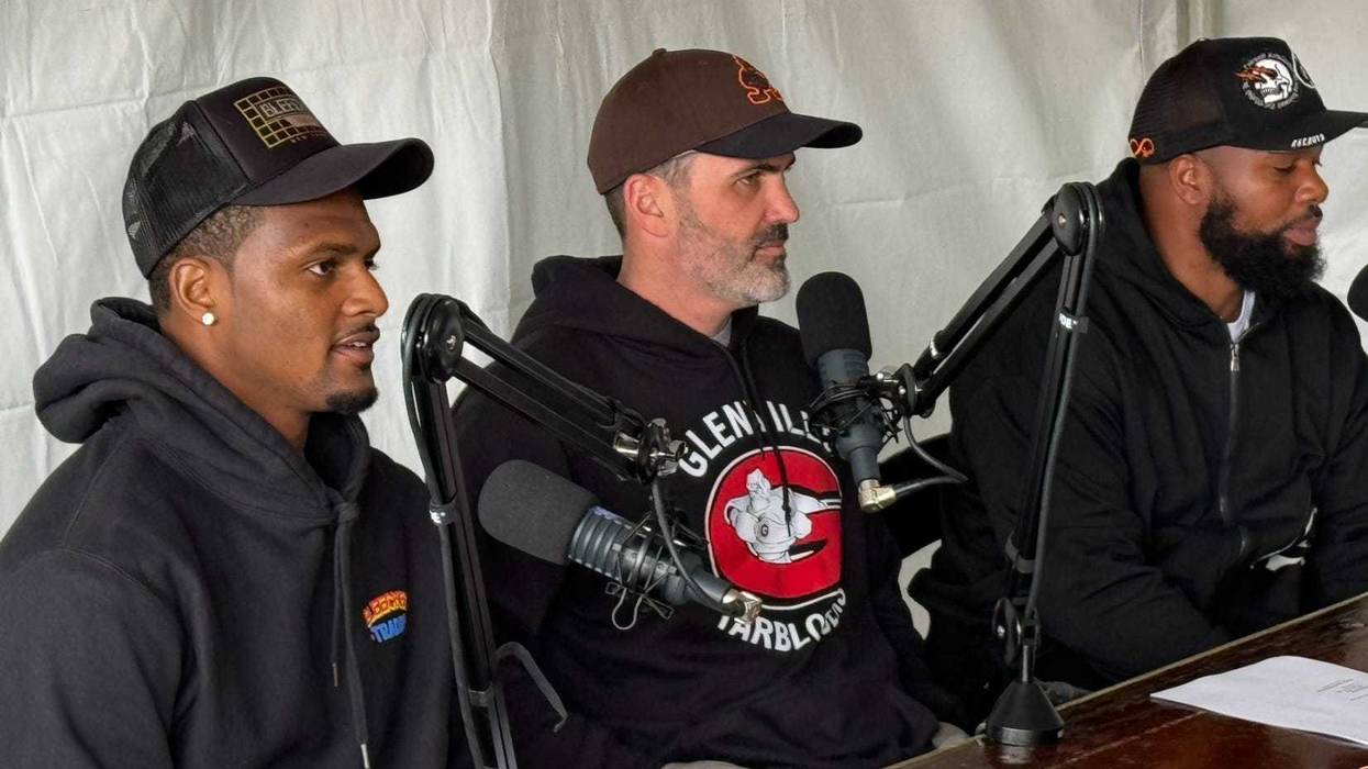 Browns quarterback Deshaun Watson (L) records a podcast with Browns head coach Kevin Stefanski (C) and his quarterbacks coach Quincy Avery (R) at the grand opening of Lefty's Cheesesteaks in University Heights, Ohio.