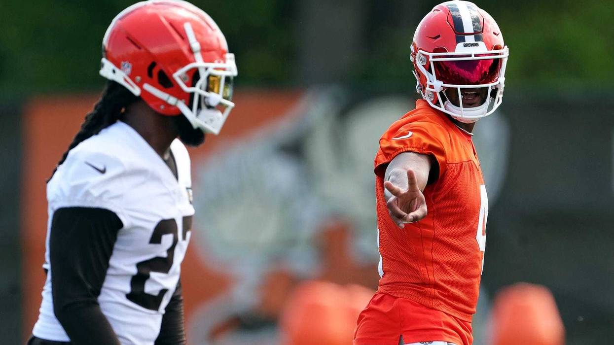 Browns quarterback Deshaun Watson signals to running back D'Onta Foreman during minicamp, Thursday, June 13, 2024, in Berea.